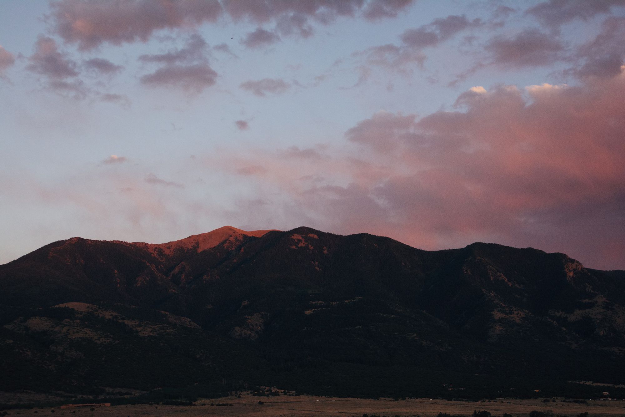 Alpenglow on a mountain ridge
